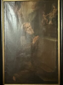 O santo eremita ajoelha-se em êxtase contemplativo diante de uma visão celestial da Virgem com o Menino, envolto em atmosfera mística e luz divina.